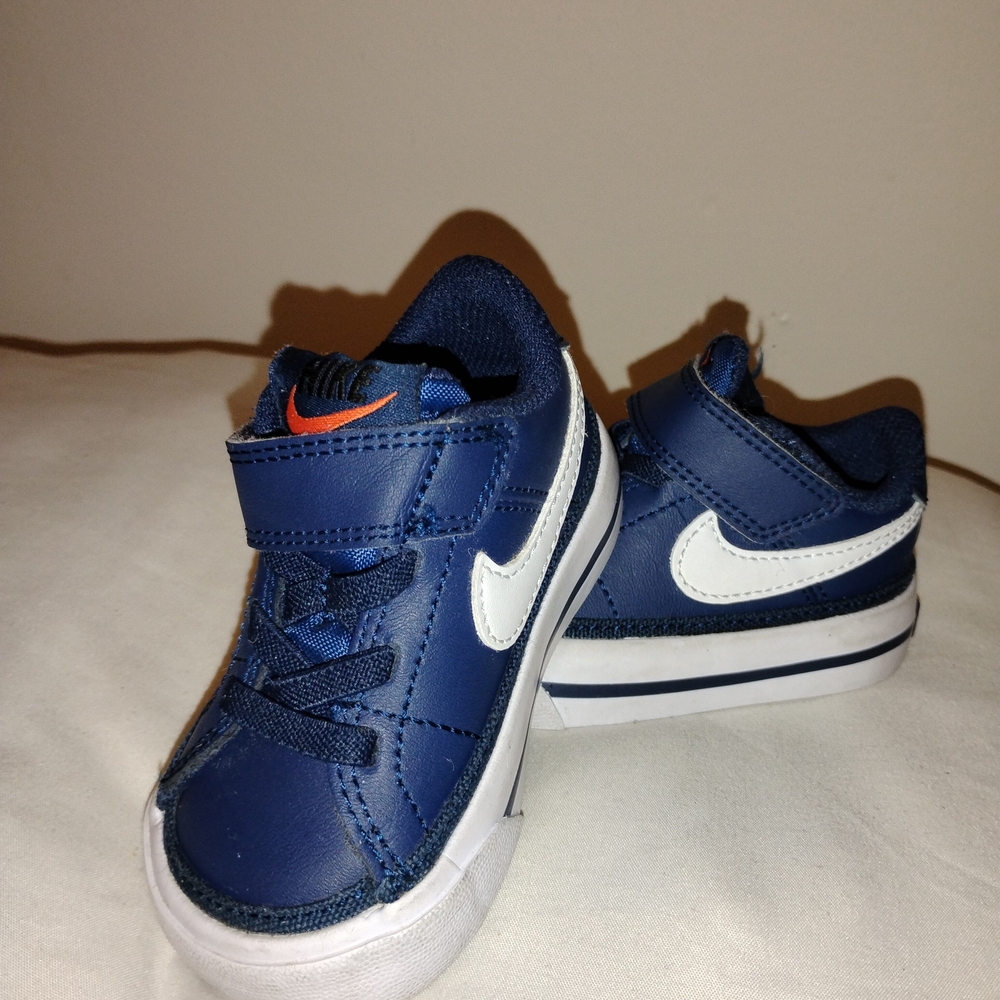 Nike Kids Navy and White Sneakers with Orange Accent